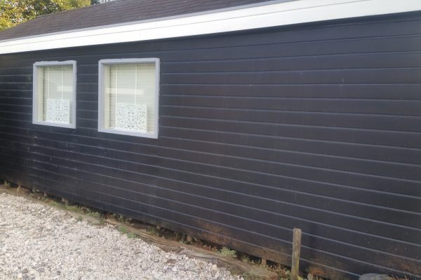 Tuinhuisje zwart oude staat